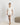 Jolene Ivory pajama set with black ruffled piping, short-sleeve top, and mid-rise longer shorts in breathable bamboo fabric.