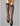 Model wearing Wolford Pure Energy 30 Leg Vitalizer Knee-Highs in black showing semi-transparent gloss and soft comfort band