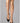 Model wearing Wolford Pure Energy 30 Leg Vitalizer Knee-Highs in gobi showing semi-transparent gloss and soft comfort band